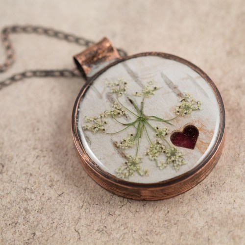 $85 - Real Queen Anne’s lace, birch bark and Maple leaf, preserved in a handmade copper bezel.